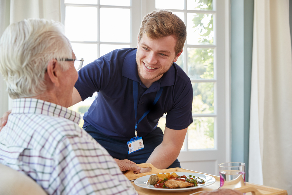 nurse and resident at a senior living center for memory care