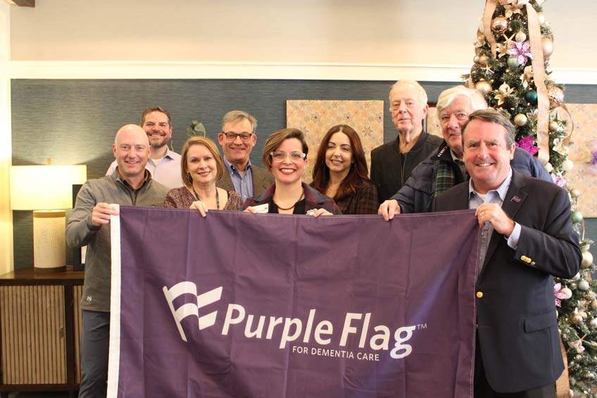 SLR employees holding the Purple Flag