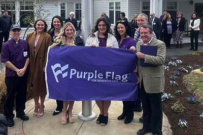 Pembroke community holding the Purple Flag.
